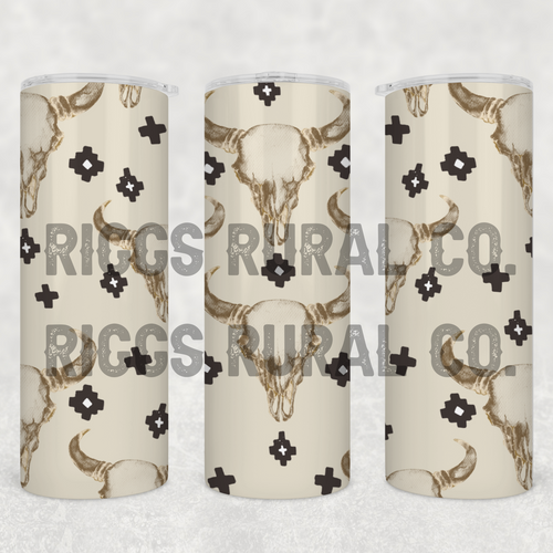 20oz tumbler with a light background and cow skull designs. 